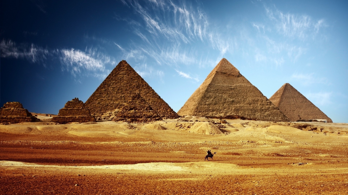 World___Egypt_A_lone_camel_on_a_background_of_the_pyramids_099603_.jpg
